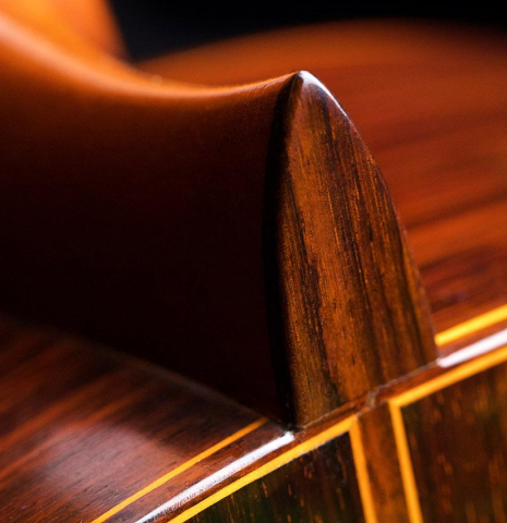 The heel, back binding and purflings of a 1968 Jose Ramirez "1a MT" classical guitar made of cedar and Indian rosewood
