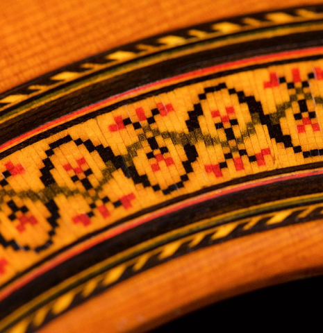 Detailed closeup of the rosette of a 1968 Jose Ramirez "1a MT" classical guitar made of cedar and Indian rosewood
