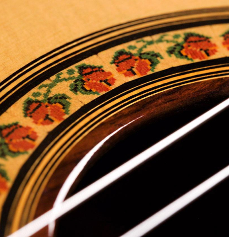The top and rosette detail of a 2004 Jose Ramirez "1a" classical guitar made of spruce and CSA rosewood
