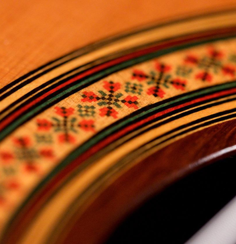 Closeup detail of the rosette of a 2019 Jose Ramirez "1a C650" classical guitar made of cedar and African rosewood