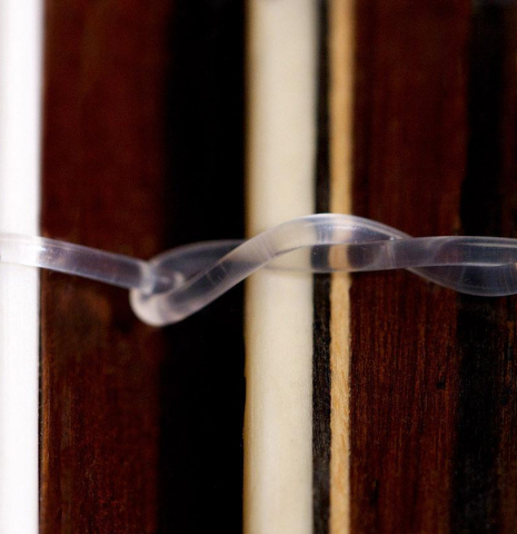 The bridge tie-block of a 1973 Jose Ramirez "2a" classical guitar made of cedar and CSA rosewood