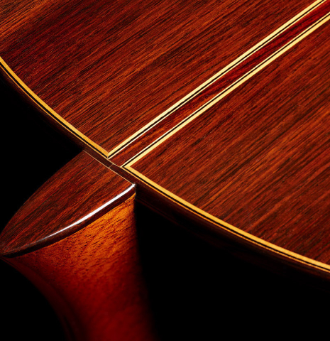 The heel, back binding and purflings of a 2001 Jose Ramirez "1a Tradicional" classical guitar made of cedar and Indian rosewood
