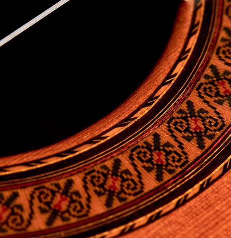 The close-up of a rosette of a 1981 Jose Ramirez "1a" classical guitar made with cedar and Indian rosewood