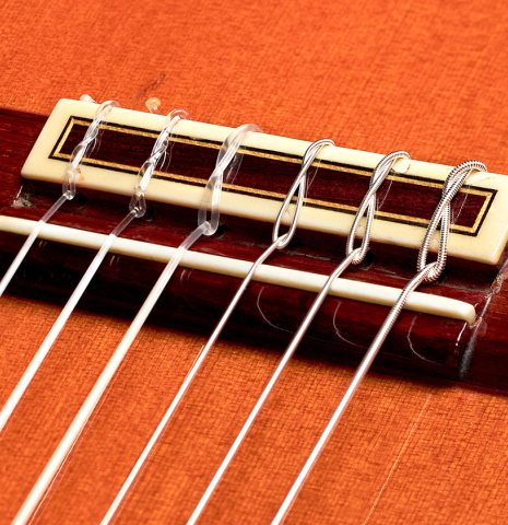 This is the bridge and saddle of a Jose Ramirez "1a" classical guitar built in 1978. It has a cedar soundboard and Indian rosewood back and sides.