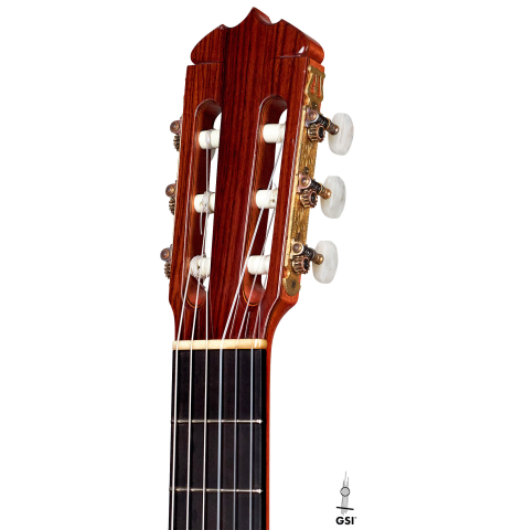 This is the head and tuners of a Jose Ramirez "1a" classical guitar built in 1978 on a white background. It has a cedar soundboard and Indian rosewood back and sides.