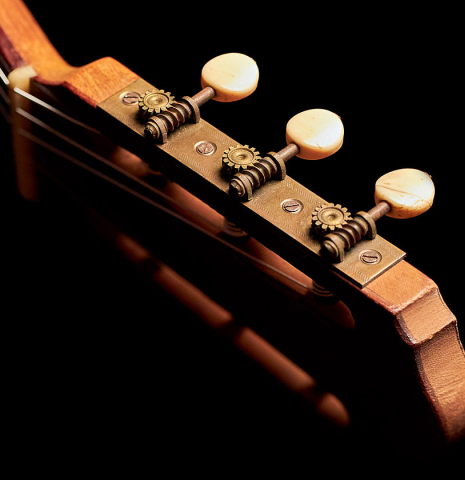 The headstock and machine heads of a 1900's Manuel Ramirez &quot;Santos&quot; vintage classical guitar made of spruce and mahogany