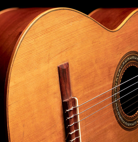 The soundboard and bridge of a 1900's Manuel Ramirez &quot;Santos&quot; vintage classical guitar made of spruce and mahogany