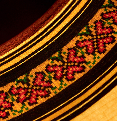 The rosette of a 2007 Jose Ramirez "1a C650-AP" classical guitar made of spruce and CSA rosewood.