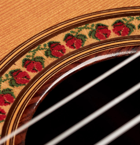 The rosette of a 1998 Jose Ramirez "1a Tradicional - Lefty" classical guitar made with cedar and Indian rosewood.
