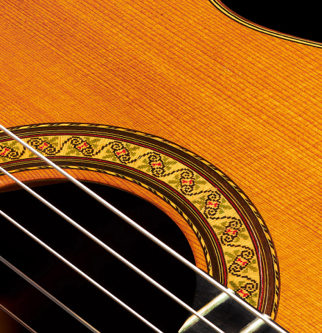 Closeup of the soundboard and rosette of a 1989 Jose Ramirez "1a" (ex Gianvito Pulzone) classical guitar made of cedar and Indian rosewood