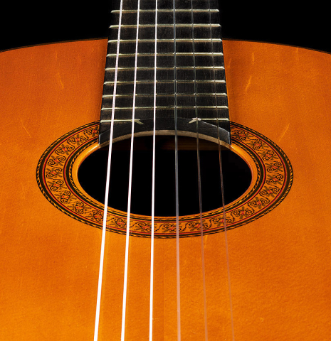 The soundboard and rosette of a 1964 Jose Ramirez "1a AM" SP/CSAR classical guitar made by Mariano Tezanos with spruce top and CSA rosewood.