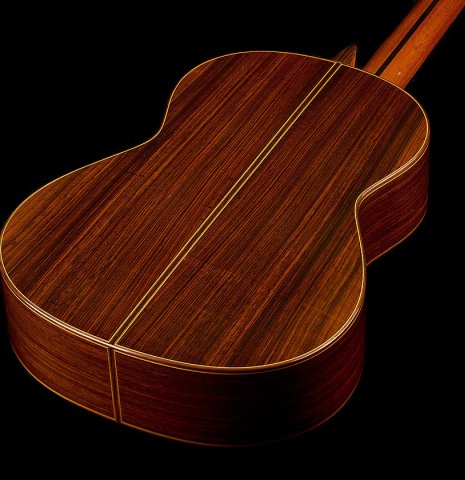 The back and sides of a 2004 Jose Ramirez "1a Tradicional" classical guitar made of spruce and Indian rosewood