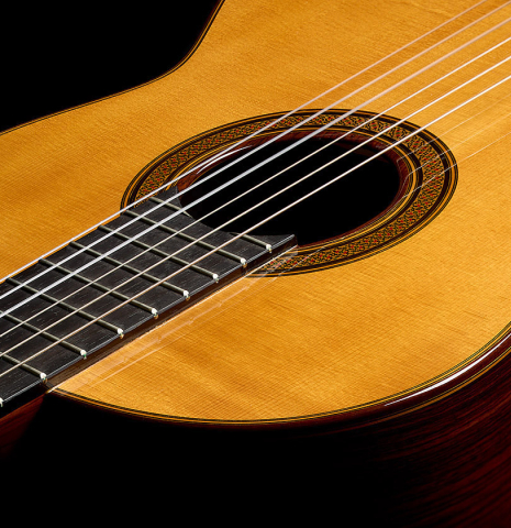The soundboard and side of a 2004 Jose Ramirez "1a Tradicional" classical guitar made of spruce and Indian rosewood