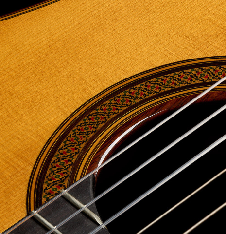 The top and rosette detail of a 2004 Jose Ramirez "1a Tradicional" classical guitar made of spruce and Indian rosewood