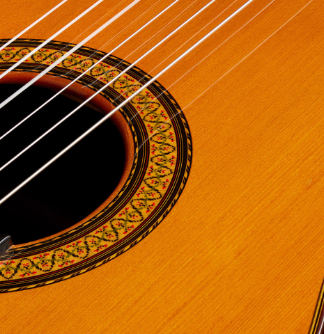 Closeup detail of the rosette of a 1990 Jose Ramirez "1a" (ex Gianvito Pulzone) classical guitar made of cedar and Indian rosewood