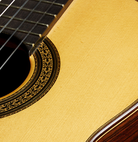 The soundboard of a 2013 Jose Ramirez "1a Antigua" classical guitar made of spruce and Indian rosewood