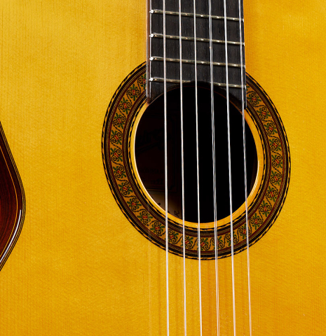 The top and rosette of a 1992 Jose Ramirez "1a Da Camara" classical guitar made of spruce and CSA rosewood