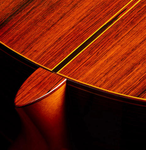 The heel, back binding and purfling of a 1973 Jose Ramirez "1a 10-String" classical guitar made of cedar and CSA rosewood