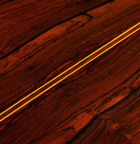 The back center seam of a 1974 Jose Ramirez "1a 8-String" classical guitar made of cedar and CSA rosewood