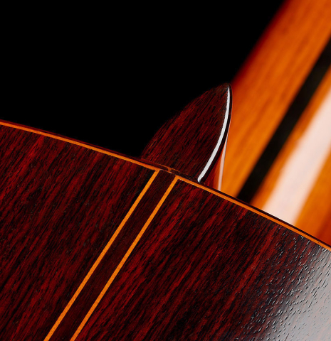 The heel, back binding and purfling of a 1977 Jose Ramirez "1a" classical guitar made of cedar and Indian rosewood