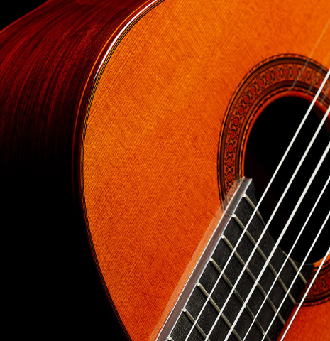 The top and fingerboard of a 1977 Jose Ramirez "1a" classical guitar made of cedar and Indian rosewood
