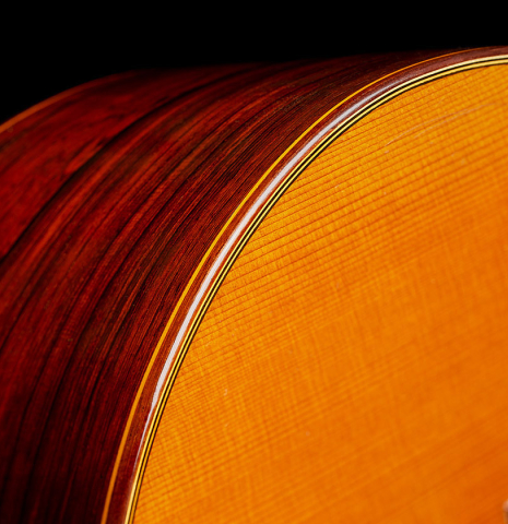 The top binding and purfling of a 1966 Jose Ramirez "1a AM" classical guitar made of cedar and CSA rosewood by Antonio Martinez.