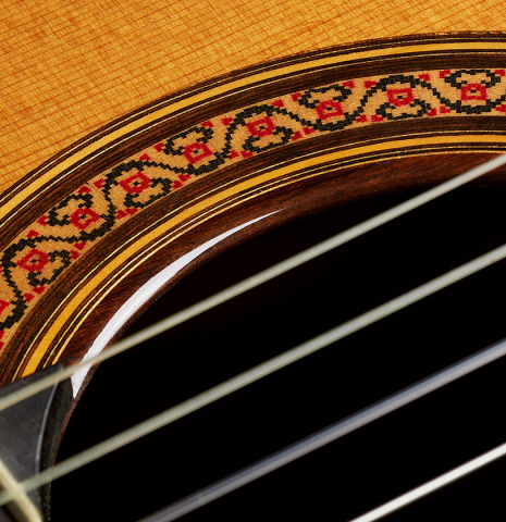 Closeup detail of the rosette of a 2004 Jose Ramirez "1a Tradicional" classical guitar made of cedar and Indian rosewood