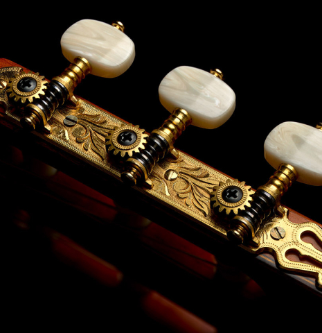 The tuning machines of a 1985 Jose Ramirez "1a" classical guitar made of cedar and Indian rosewood