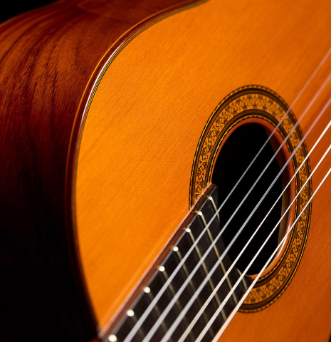 The soundboard and rosette of a 1985 Jose Ramirez "1a" classical guitar made of cedar and Indian rosewood