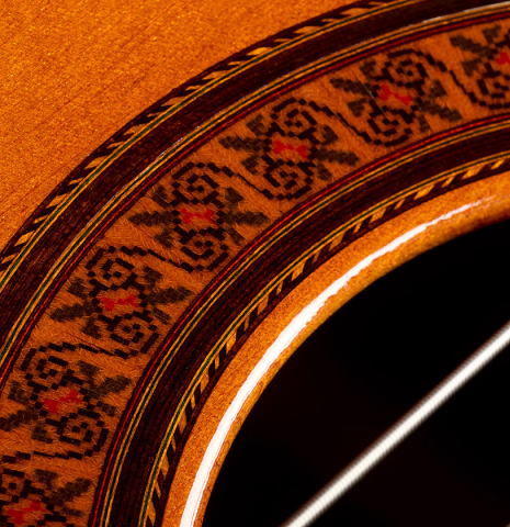 The soundboard and rosette of a 1969 Jose Ramirez "1a MT" classical guitar made of cedar and CSA rosewood