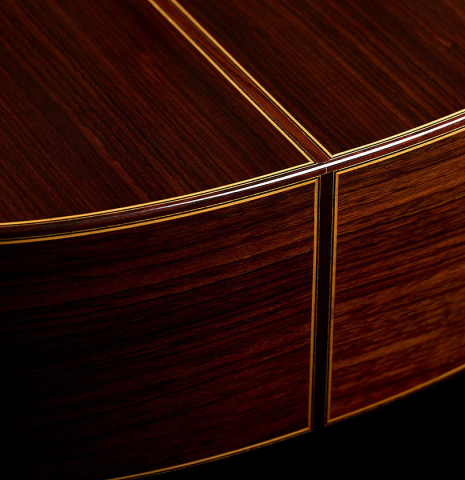 The back and sides at the foot of a 1999 Jose Ramirez "1a" classical guitar made of cedar and Indian rosewood