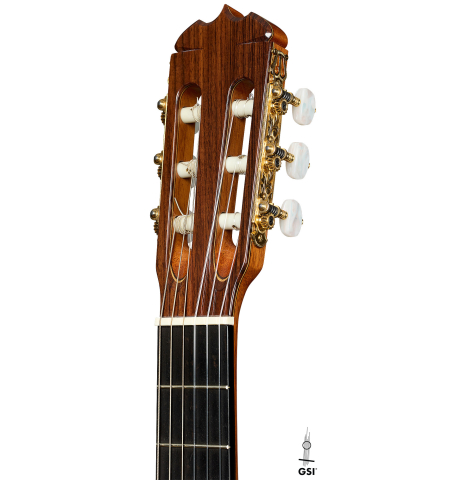 The headstock of a 1999 Jose Ramirez "1a" classical guitar made of cedar and Indian rosewood
