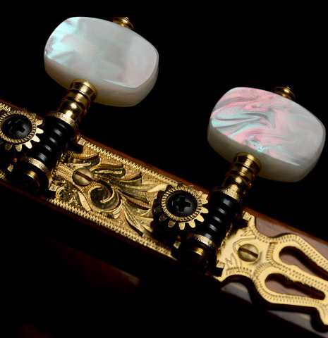 The Fustero tuning machines of a 1999 Jose Ramirez "1a" classical guitar made of cedar and Indian rosewood