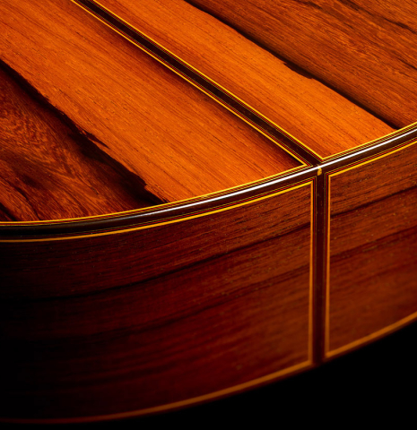 The back and sides at the foot of a 2007 Jose Ramirez "Elite" classical guitar made of cedar and African rosewood