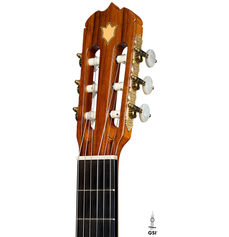 The headstock of a 2007 Jose Ramirez "Elite" classical guitar made of cedar and African rosewood