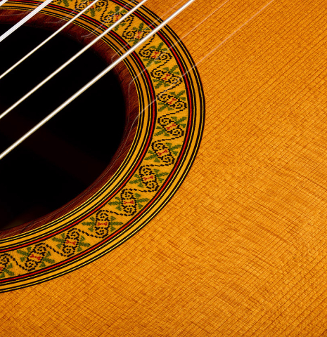The top and rosette of a 2023 Jose Ramirez "1a C650" classical guitar made of cedar and Indian rosewood