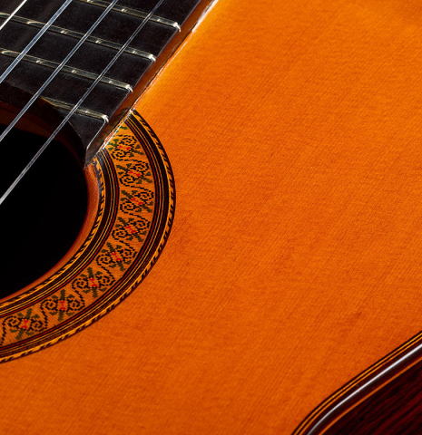 The soundboard and rosette of a 1979 Jose Ramirez "1a" classical guitar made of cedar and Indian rosewood