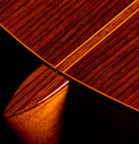 The heel, back binding and purfling of a 1979 Jose Ramirez "1a" classical guitar made of cedar and Indian rosewood