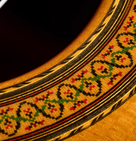 The soundboard and rosette of a 1979 Jose Ramirez "1a" classical guitar made of cedar and Indian rosewood