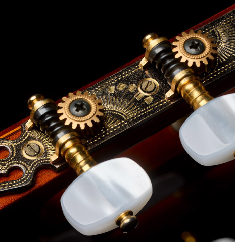 The tuning machines of a 1975 Jose Ramirez "1a" classical guitar made of cedar and Indian rosewood