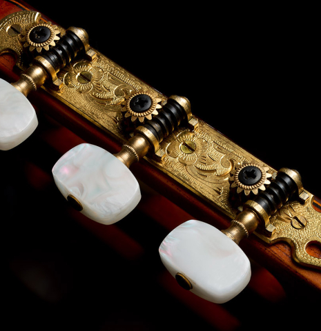 The tuning machines of a 1977 Jose Ramirez "1a" classical guitar made of cedar and Indian rosewood