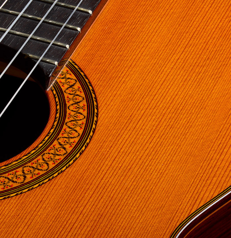 The top and rosette of a 1977 Jose Ramirez "1a" classical guitar made of cedar and Indian rosewood