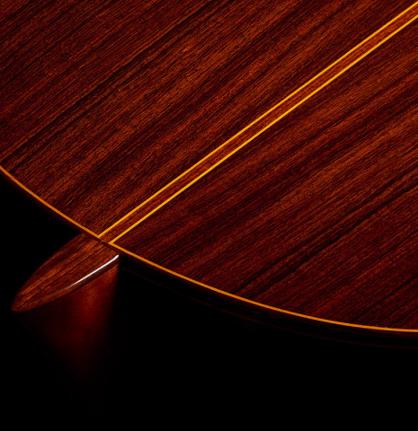 The heel, back binding and purfling of a 1982 Jose Ramirez "1a" classical guitar made of cedar and Indian rosewood