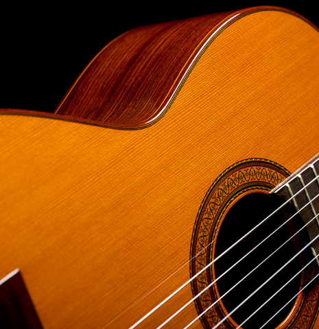The soundboard, side and rosette of a 1982 Jose Ramirez "1a" classical guitar made of cedar and Indian rosewood