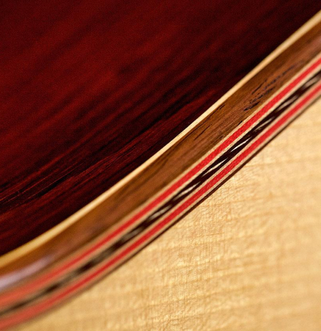 The inlay and binding of a 2010 John Ray "Torres" classical guitar made with spruce and CSA rosewood