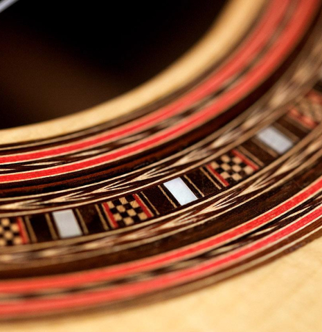 The close-up of a rosette of a 2010 John Ray "Torres" classical guitar made with spruce and CSA rosewood