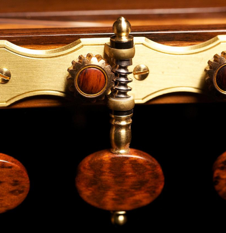 The tuning machines of a 2012 John Ray "1892 Torres" classical guitar made of spruce and maple