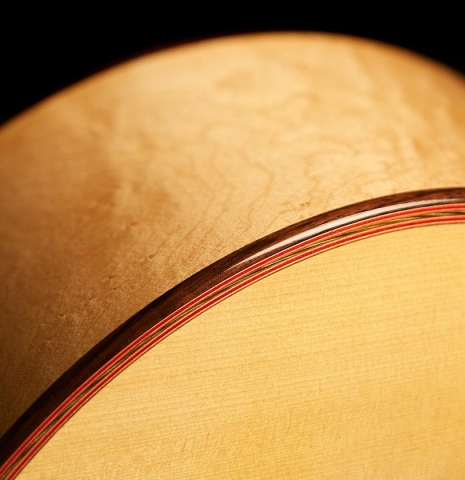 The top purfling and binding of a 2012 John Ray "1892 Torres" classical guitar made of spruce and maple