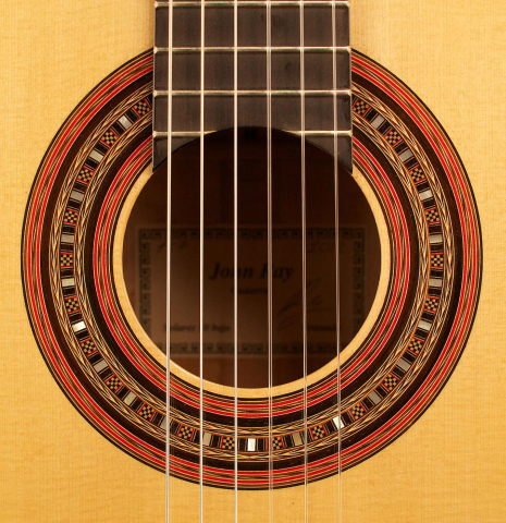 The rosette of a 2012 John Ray "1892 Torres" classical guitar made of spruce and maple