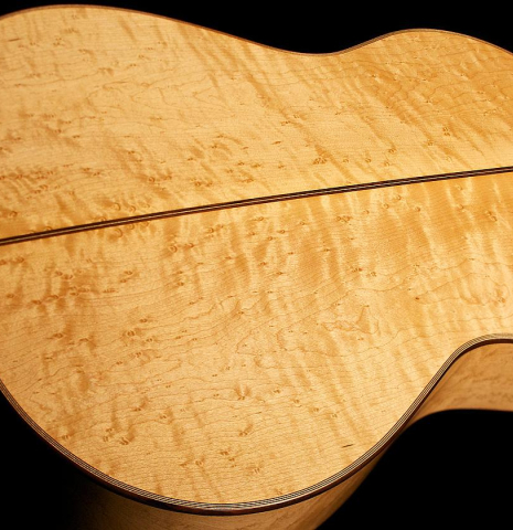 The back and sides of a 2012 John Ray "1892 Torres" classical guitar made of spruce and maple